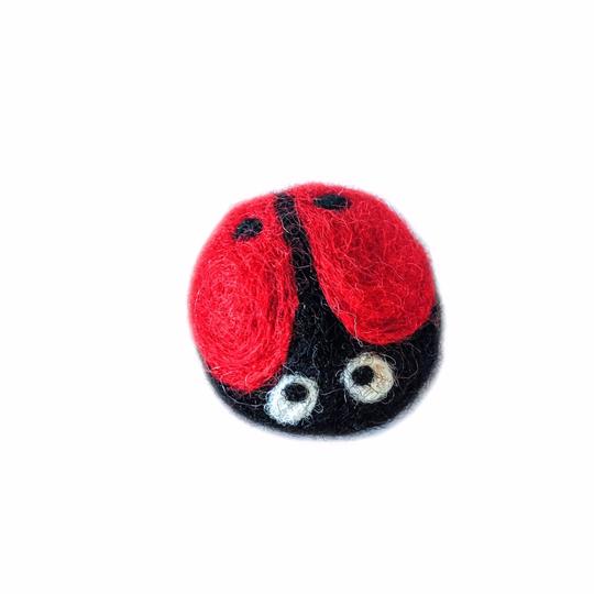 Gina the Ladybug wool cat toy on a white background, hand-felted from cruelty-free New Zealand wool.