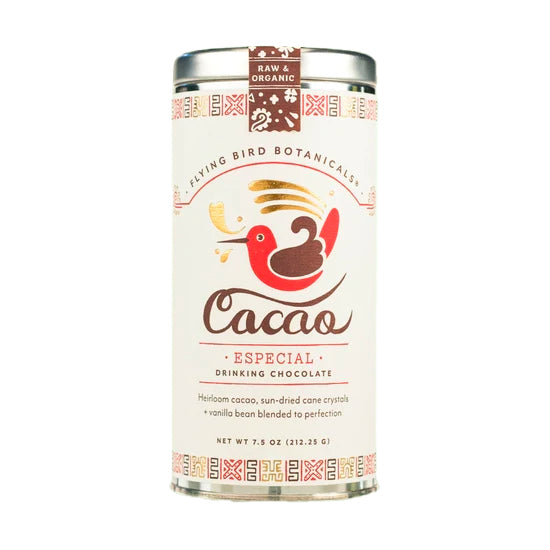 Flying Bird Botanicals cacao and tea tins grouped together, featuring ethically sourced, organic blends made in the Pacific Northwest.