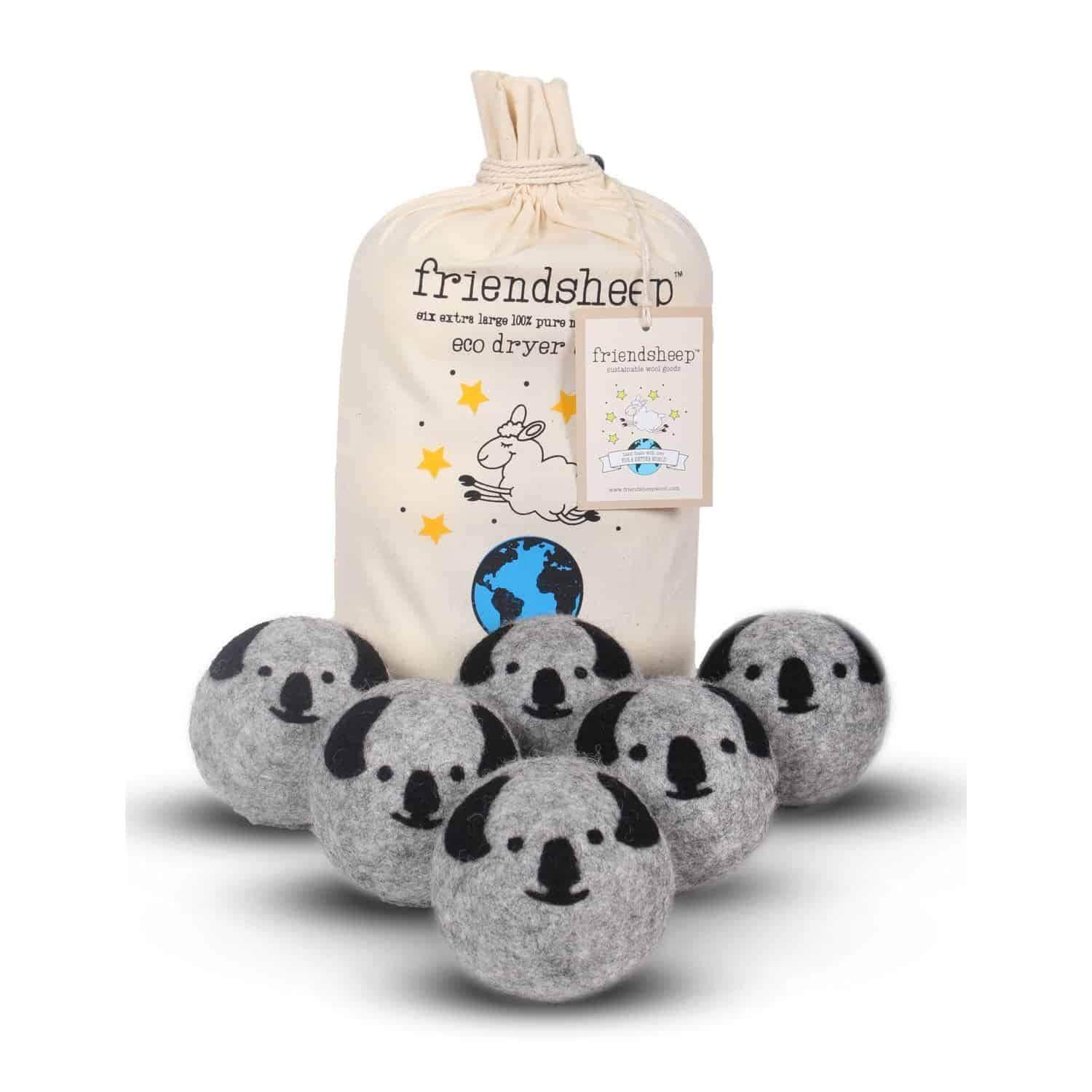 Six grey koala wool dryer balls with black details and a cotton drawstring bag, made from organic wool. Eco-friendly, cruelty-free, and compostable.
