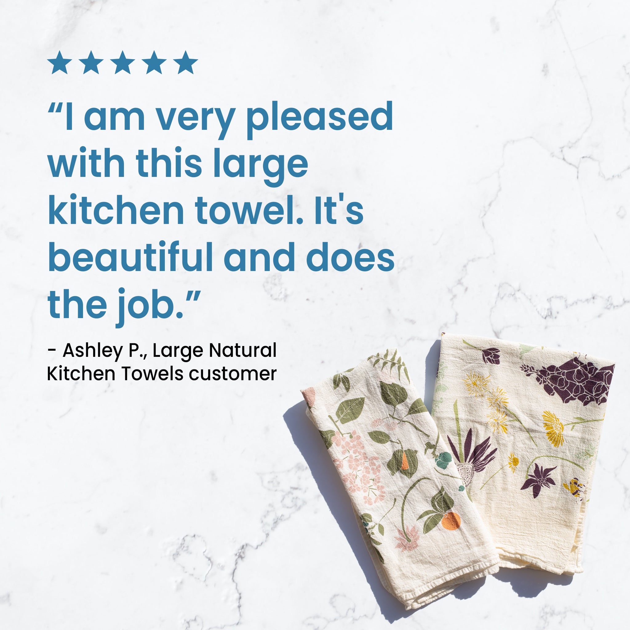 A five star customer review in blue text reads: "I am very pleased with this large kitchen towel. It's beautiful and does the job." Below the text, two kitchen towels are shown on a marble surface.