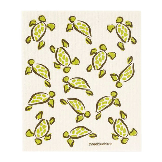 Olive green sea turtles on this reusable Swedish dishcloth, ready to tackle messes with water, soap, or cleaners.