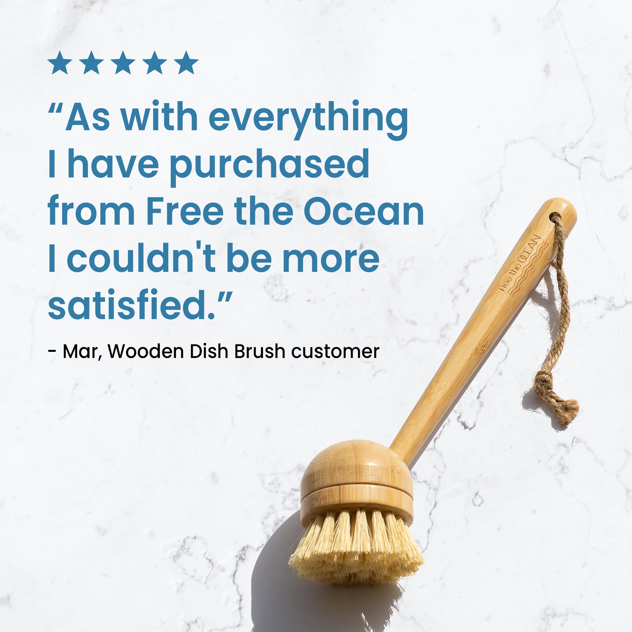 Wooden dish brush with natural bristles accompanied by a customer review saying, ‘As with everything I have purchased from Free The Ocean, I couldn’t be more satisfied.’