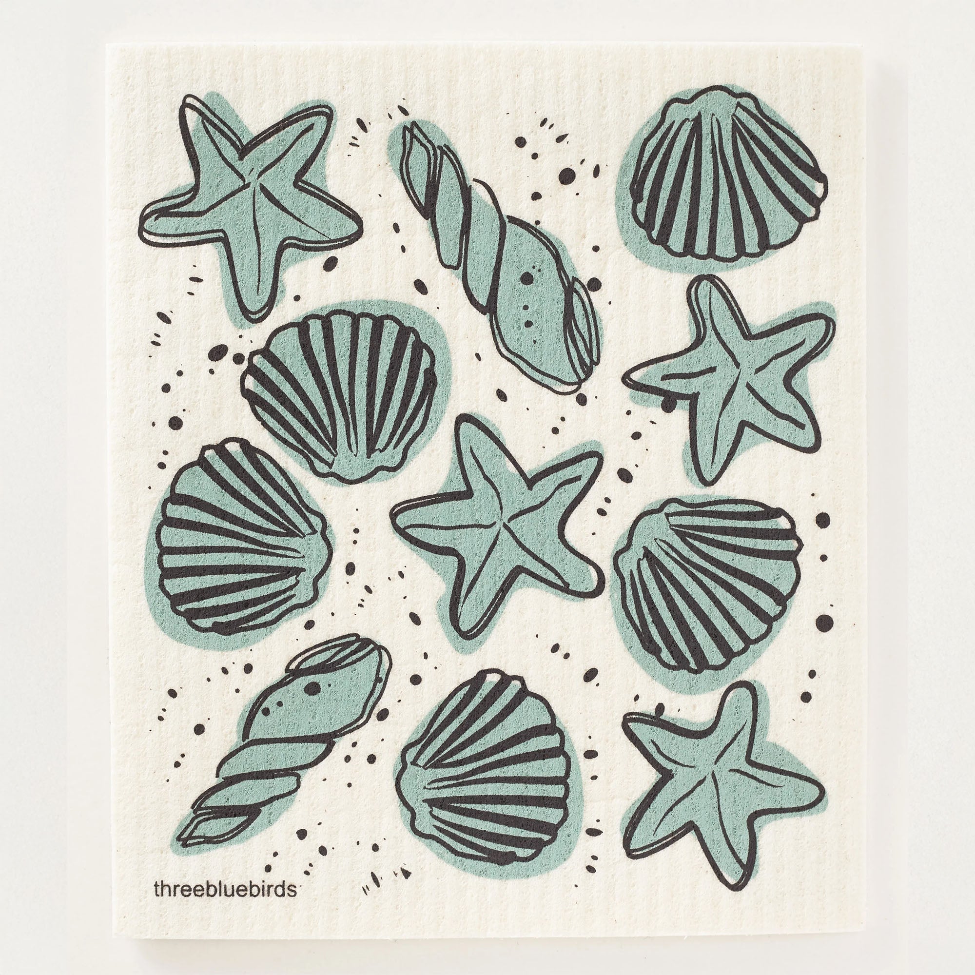 Coastal-themed Swedish dishcloth featuring a variety of seashells against a white background. A biodegradable option for your cleaning needs