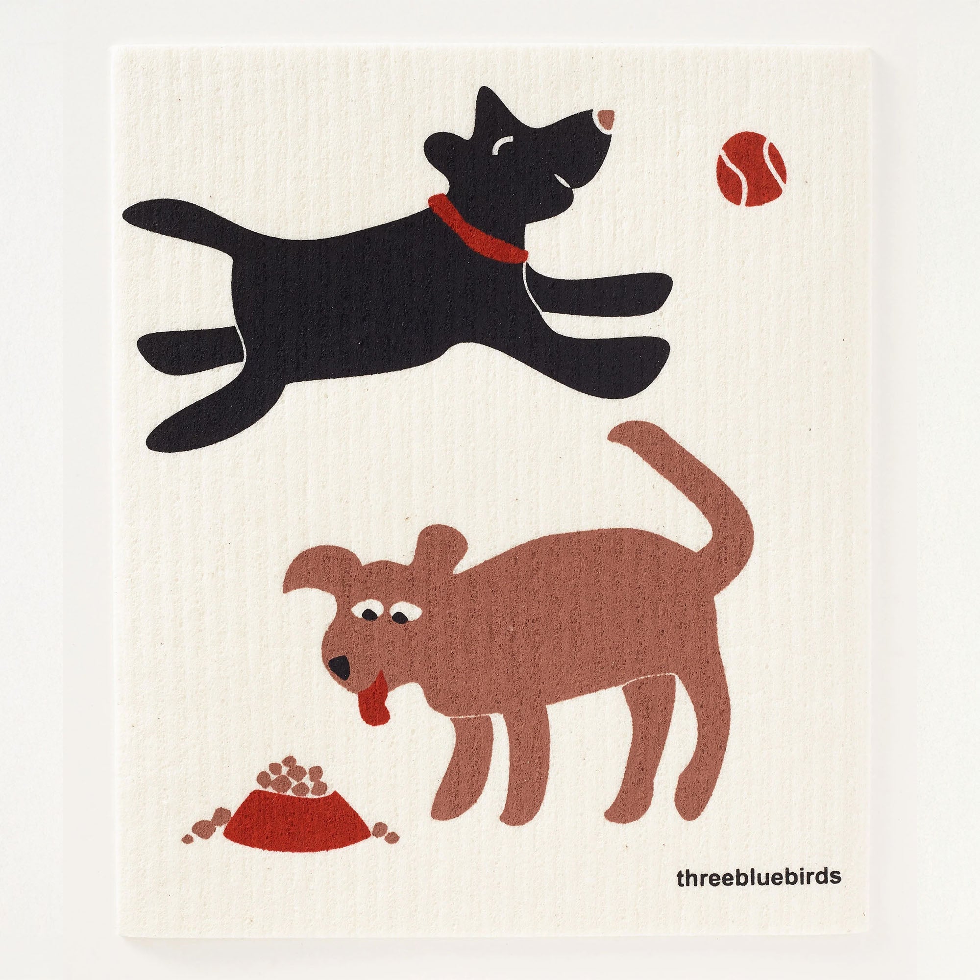 A playful black dog leaps for a tennis ball, while a brown dog sits by a bowl of food, both graces this reusable Swedish dishcloth, suitable for use with your preferred cleaning solutions