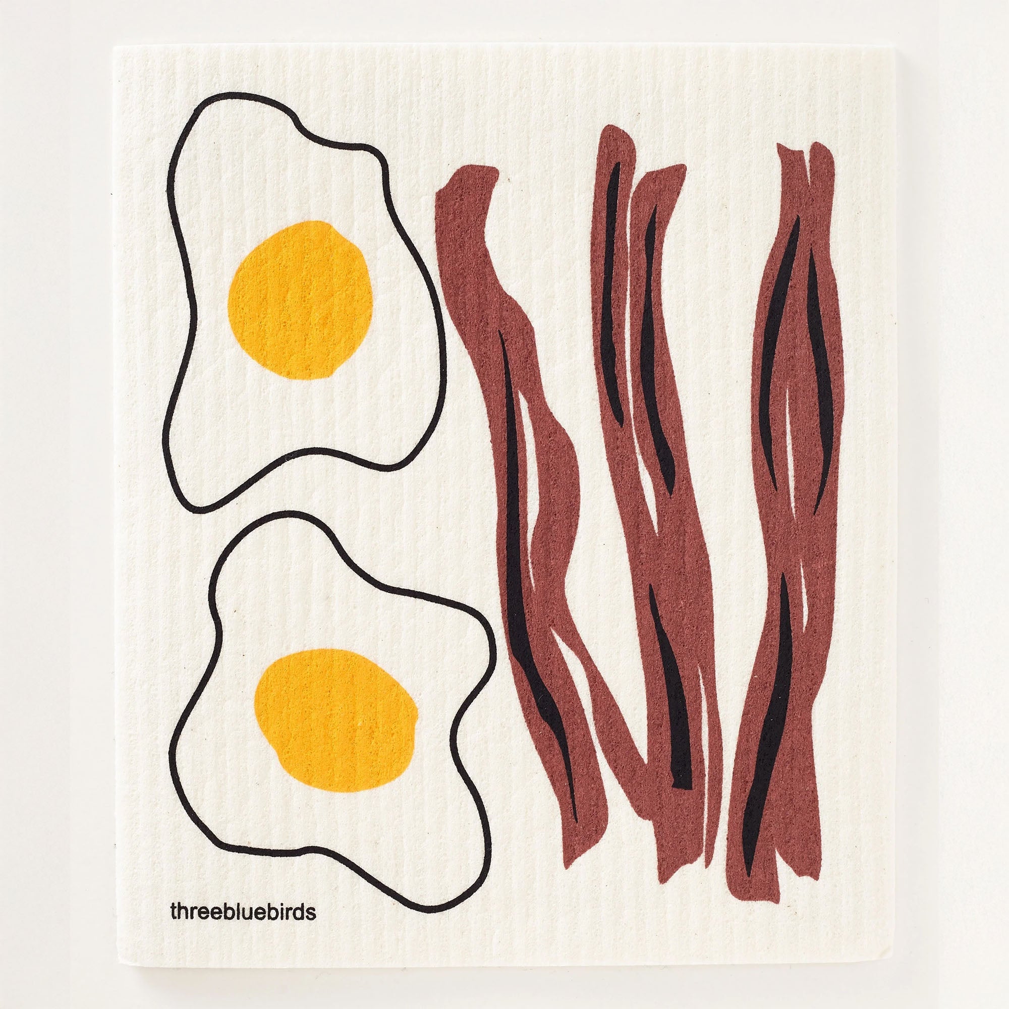 A breakfast-themed reusable dishcloth showcasing crispy broyn bacon alongside sunny yellow fried eggs. This cloth is biodegradable