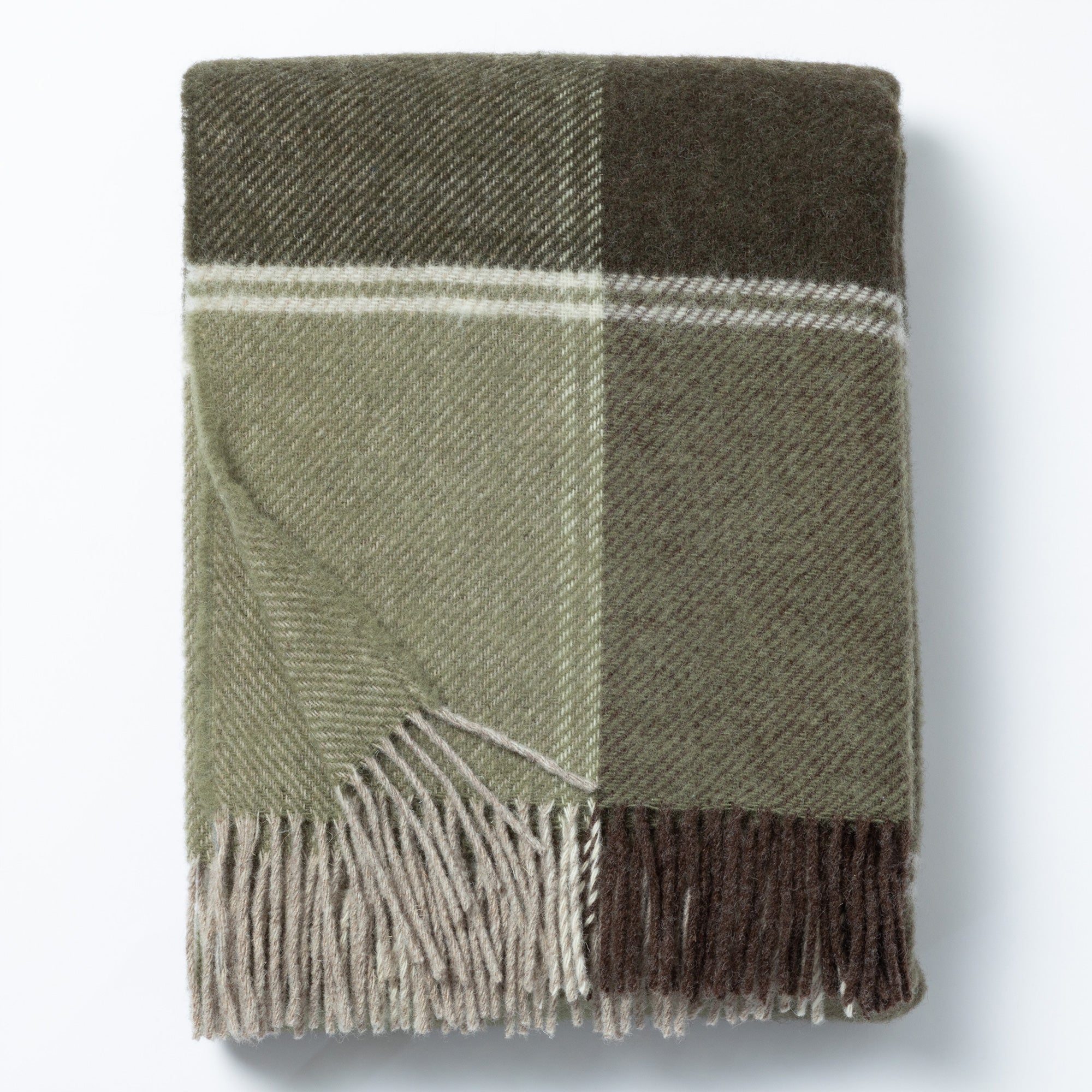 Folded green and brown plaid 100% wool throw blanket with fringe edges. Handmade in Ukraine to provide warmth and support for others.