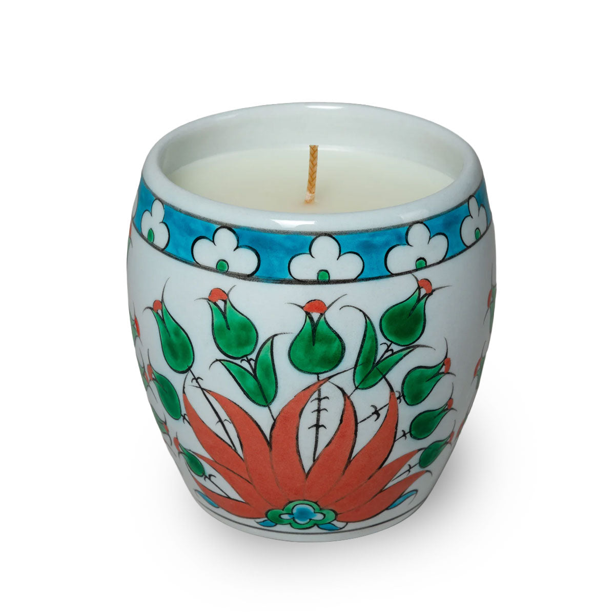 Decorative candle in a hand-painted ceramic holder on a white background