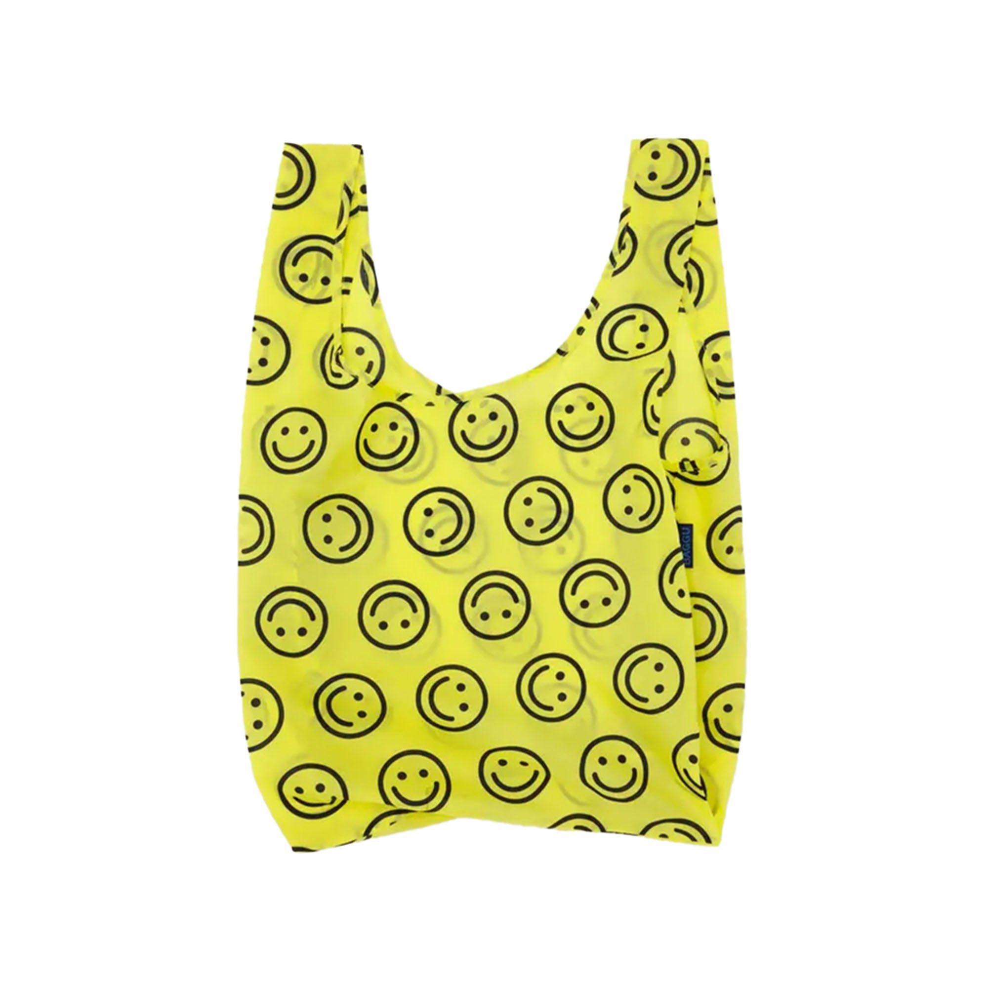 Yellow Baggu reusable bag with black smiley face pattern on a white background