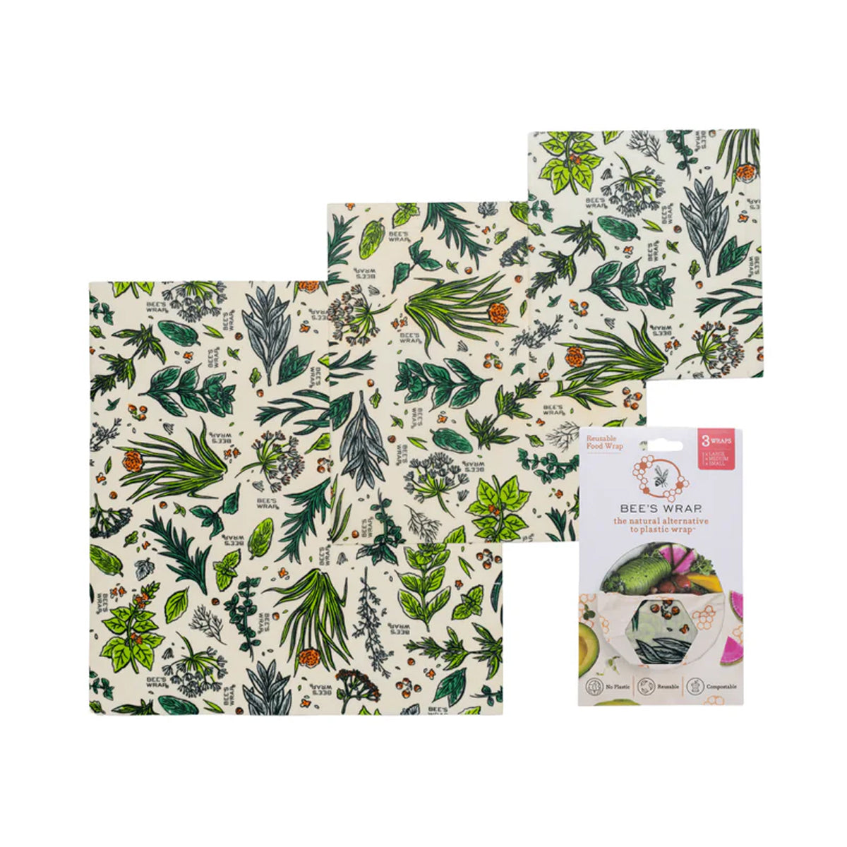 Three reusable beeswax wraps with a green botanical and herb pattern on a cream background, shown next to their retail packaging.