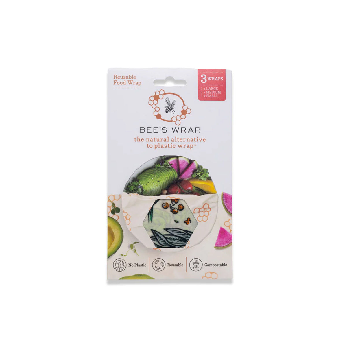 Bee's Wrap reusable food wrap in its retail packaging, featuring a white card with illustrations of fresh vegetables and a printed circular cutout showing the patterned wrap itself.