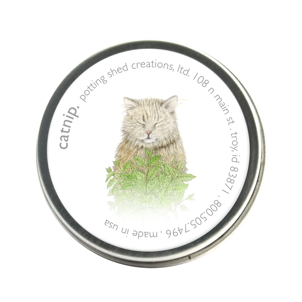 A charming catnip tin with a blissful cat among green leaves. The label includes the brand “potting shed creations” contact info and "made in USA"