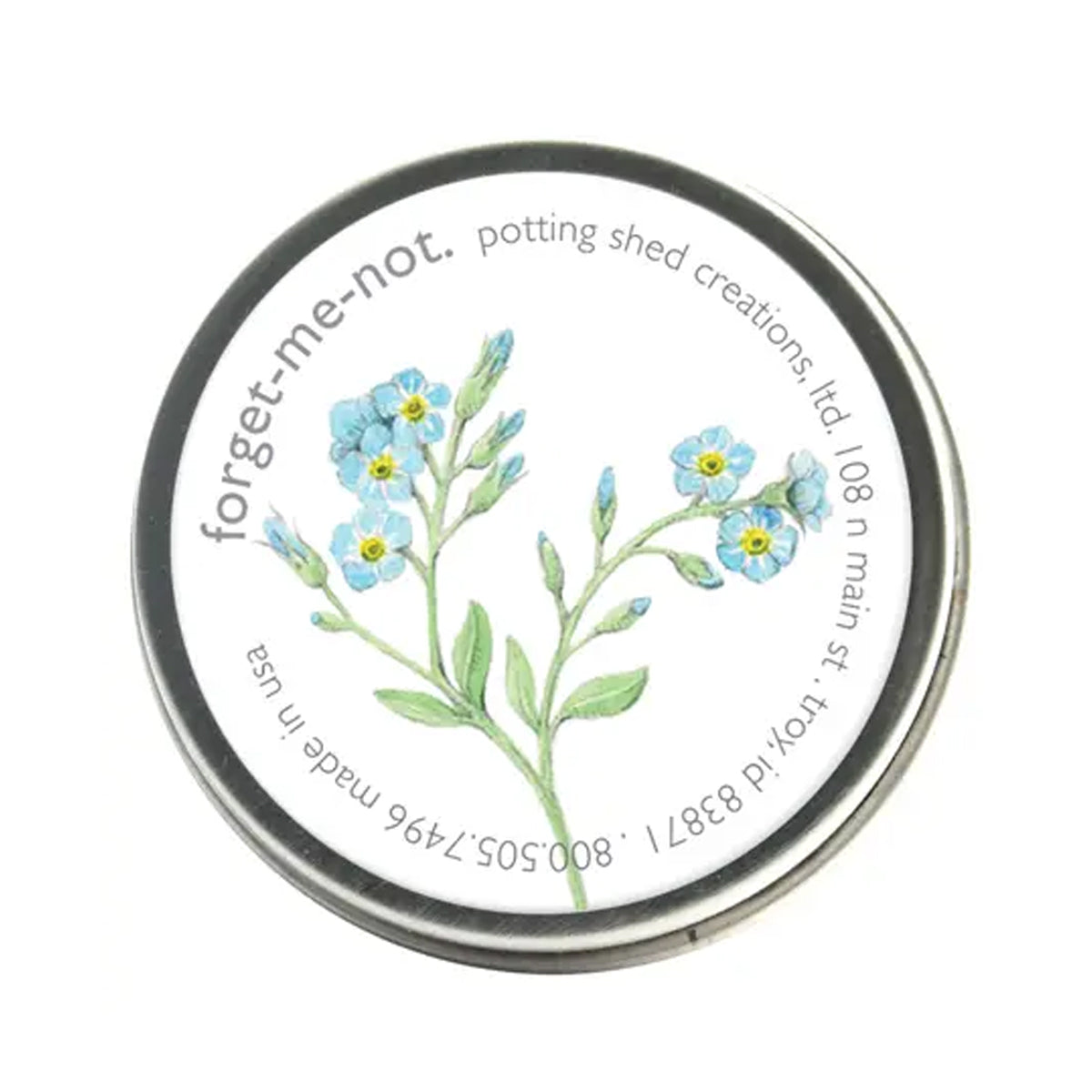A silver tin of garden sprinkles with a white label on the lid. The label features a watercolor illustration of a sprig of light blue forget-me-not flowers, with the text 'forget-me-not, potting shed creations' around the edge.