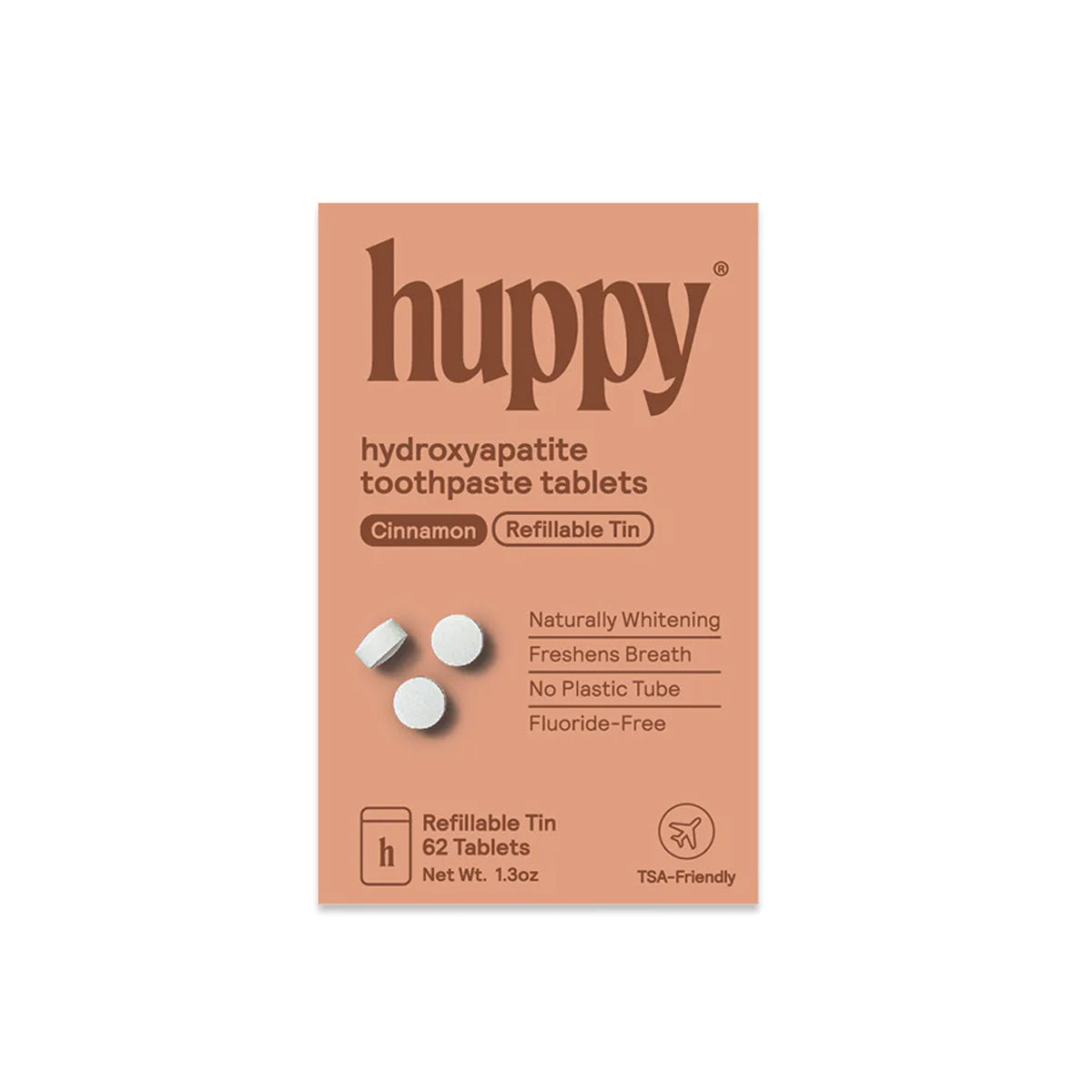 Box of cinnamon huppy hydroxyapatite toothpaste tablets on a white background