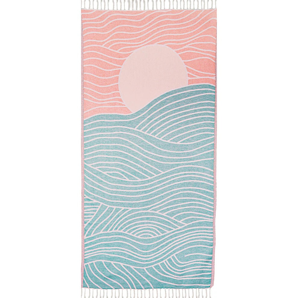 Colorful Turkish cotton beach towel featuring a sun and wave pattern in bright, playful colors. Made from fair trade, upcycled cotton.