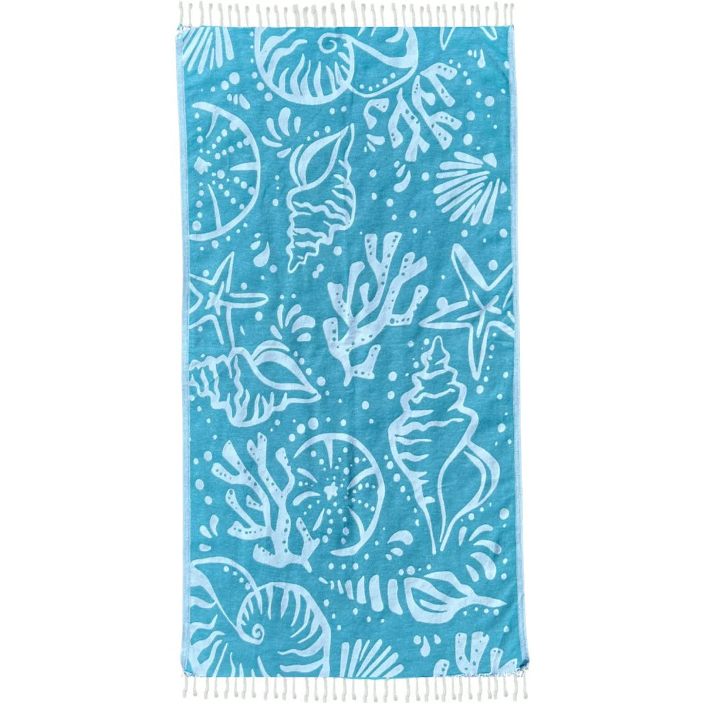 Blue Turkish beach towel with white design, crafted from lightweight, quick-drying Turkish cotton.