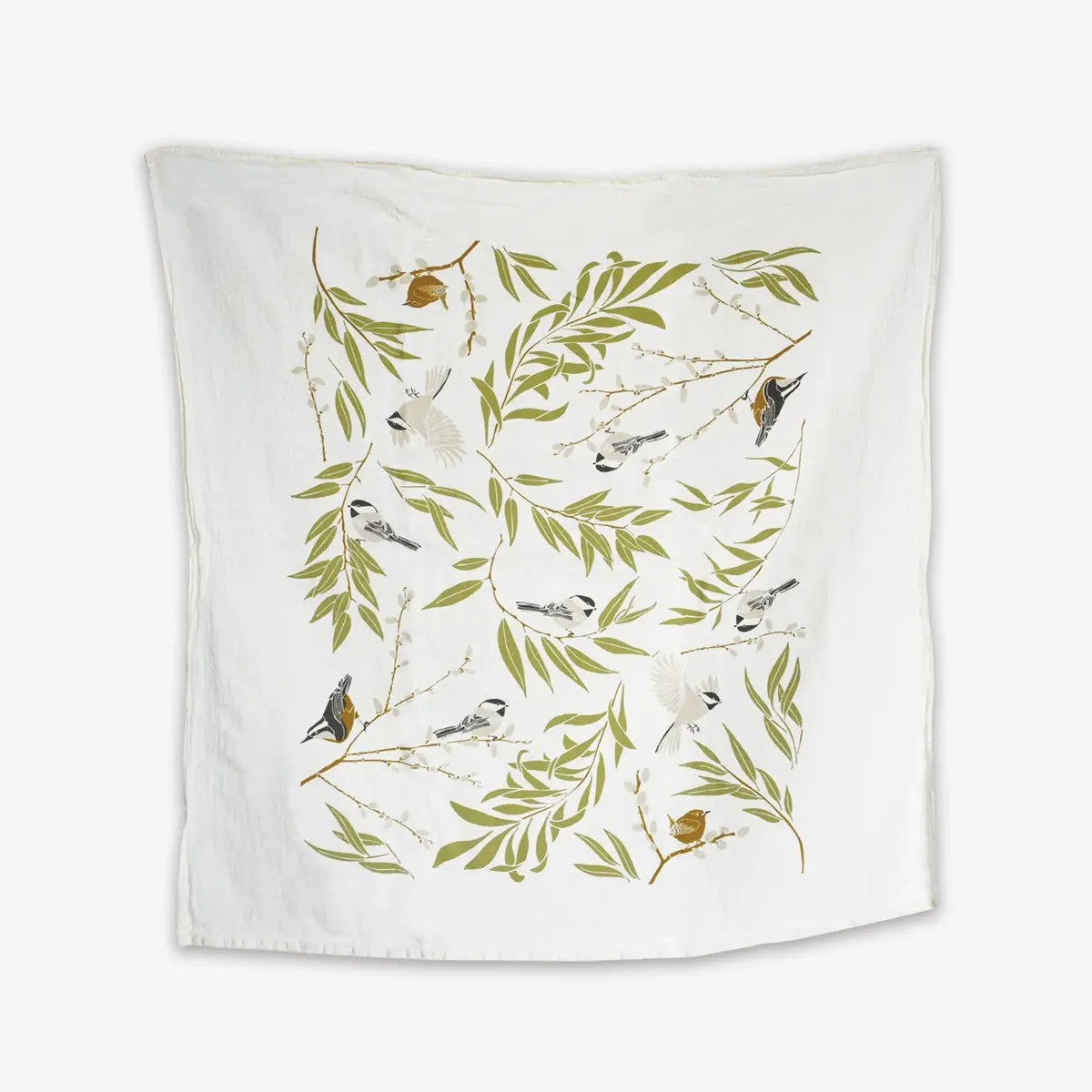 A white kitchen towel features a charming pattern of small songbirds perched on leafy green branches with white blossoms.