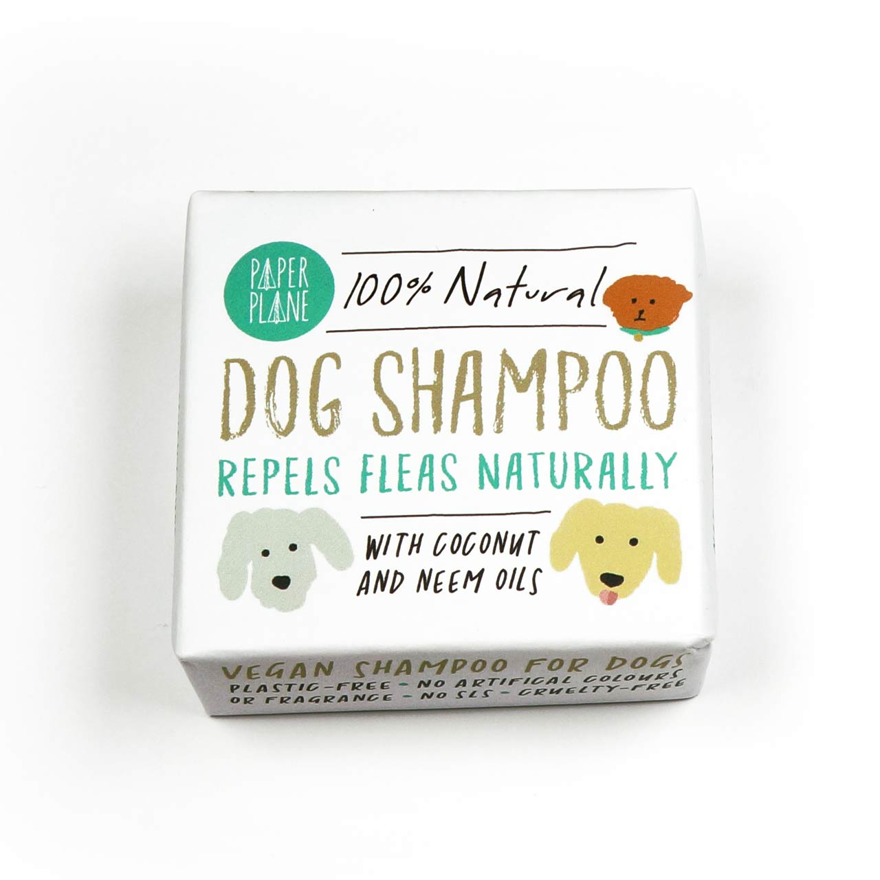 A box of Paper Plane 100% Natural Dog Shampoo is shown. The packaging indicates that it is vegan, plastic-free, cruelty-free and repels fleas naturally with coconut and neem oils.